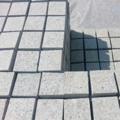 Grey granite patterned floor tiles